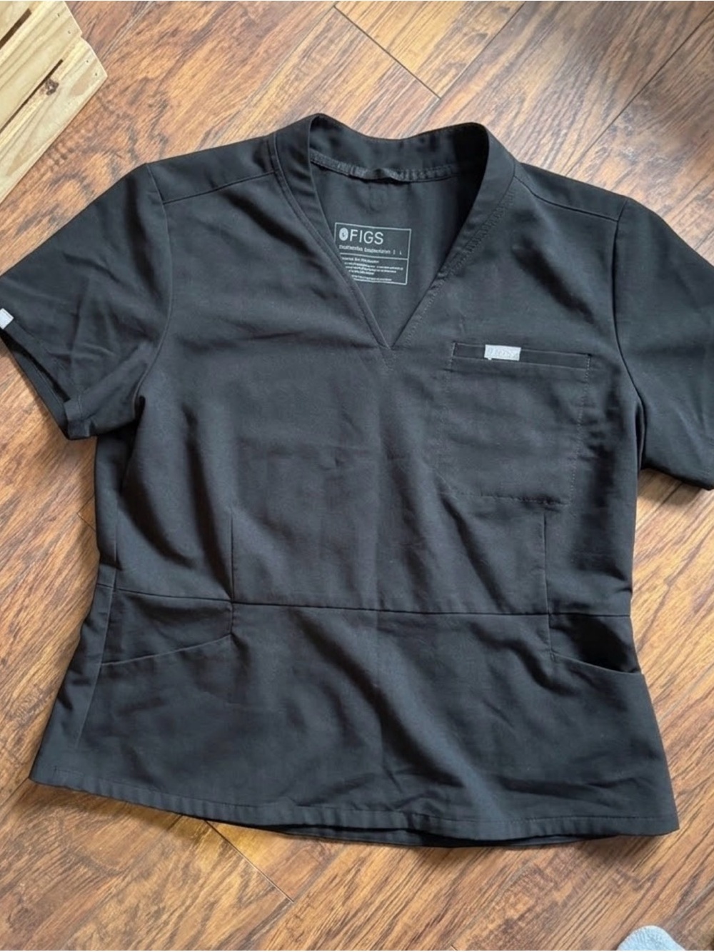FIGS Women's Black V-Neck Scrub Top with Front Pockets